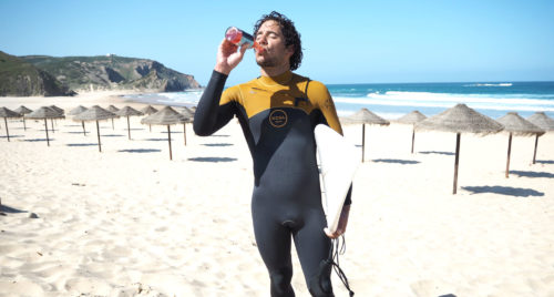 Surfer drinking Surf Kombucha